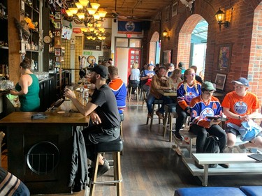 VANCOUVER, May 14, 2024 -- Oilers fans enjoying pregame meals at Gastown's Black Frog Eatery. PHOTO BY GORD MCINTYRE