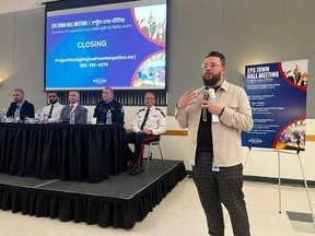 Yasin Cetin of the Edmonton Police Service's equity and inclusion branch takes questions from concerned community members at the Feb. 8 town hall put on by the EPS regarding the spate of extortion and arson cases that have impacted the South Asian community in Edmonton in recent months.