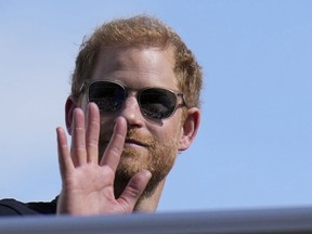 FILE - Britain's Prince Harry, the Duke of Sussex, waves during the Formula One U.S. Grand Prix auto race at Circuit of the Americas, on Oct. 22, 2023, in Austin, Texas. Prince Harry arrived in London on Tuesday May 7, 2024 to mark the 10th anniversary of the Invictus Games but won't see his father during the visit, a spokesperson said.