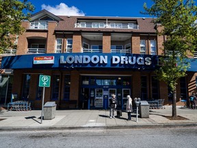 People wait outside of the London Drugs Kerrisdale location on Monday, April. 29, 2024. London Drugs says it is gradually reopening its stores following a cybersecurity incident that's shut all of its more than 80 locations across Alberta, Saskatchewan, Manitoba and B.C.