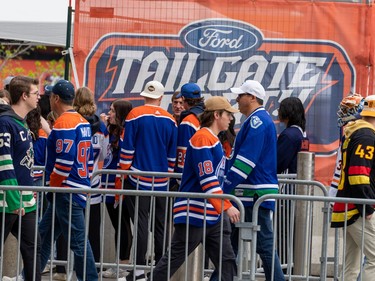Oilers and Canucks fans line up to go into the Ice District Plaza before the start of the Vancouver Canucks, Edmonton Oilers second-round NHL playoff game in Edmonton on Tuesday, May 14, 2024 in Edmonton. Greg Southam-Postmedia