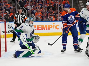 Vancouver Canucks' goalie Arturs Silovs (31) makes a save as Edmonton Oilers' Zach Hyman (18) watches during first period second-round NHL playoff action in Edmonton on Tuesday, May 14, 2024 in Edmonton. Greg Southam-Postmedia