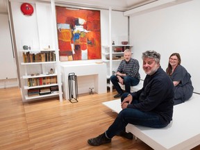 The West Vancouver Art Museum is celebrating the 100th anniversary of architect Arthur Erickson's birth with an exhibition. The museum is recreating Erickson's living room. Pictured, from left, is Brian Broster and Clinton Cuddington, board members of the Arthur Erickson Foundation, and West Vancouver Art Museum curator Hilary Letwin, on May 10.