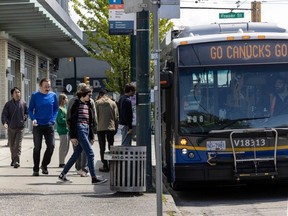 Vancouver, BC: MAY 17, 2024 -- People get on and off a Translink bus at E. Broadway in Vancouver, BC Friday, May 17, 2024. (Photo by Jason Payne/ PNG) (For story by reporter) [PNG Merlin Archive]