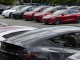 Dozens of Tesla EVs sit in a parking lot at 64 Avenue and 197th Street in Langley.