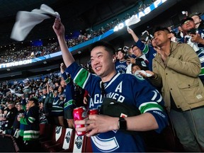 Gary Chan cheers inside Rogers Arena as the Canucks play the Predators in Nashville. Vancouver May 3.