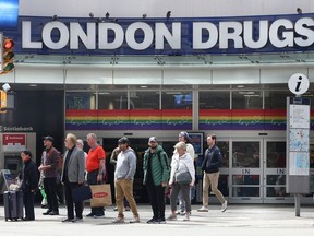 Shoppers at London Drugs at W. Georgia St and Granville Ave as the company opens stores following a cyber attack,, in Vancouver, B.C., on May 6, 2024.