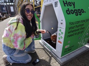 Trina Doyle and her dog Rogue at the PetParker station at Granville Island May 15.