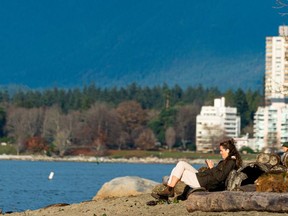 File photo of a woman enjoying the sunshine in Vancouver.