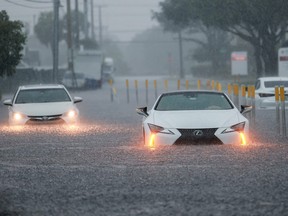 Stalled vehicles sit in a flooded street on June 12, 2024 in Aventura, Florida. The region is being adversely impacted as tropical moisture passes through the area. (Photo by Joe Raedle/Getty Images)
