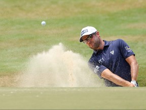 Corey Conners of Canada hits out of a greenside bunker on the fourth hole during the final round of the 124th U.S. Open at Pinehurst Resort on Sunday,.