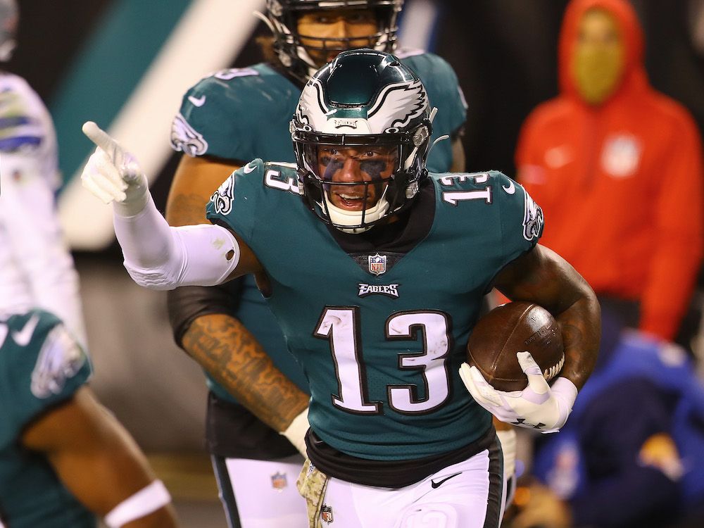 Travis Fulgham points at his teammates