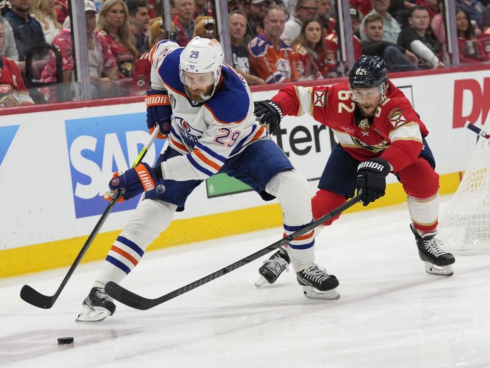 Edmonton Oilers centre Leon Draisaitl and Florida Panthers defenceman Brandon Montour go after the puck during the third period of Game 2.