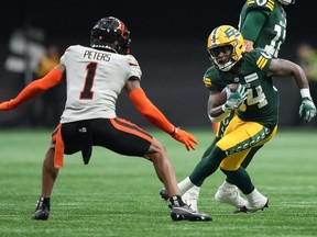 Garry Peters noticed something was a little different as his B.C. Lions teammates filtered into training camp last month. Edmonton Elks' Jermaine Brown Jr., back right, carries the ball as Peters defends during the first half of a pre-season CFL football game, in Vancouver, B.C., Friday, May 31, 2024.