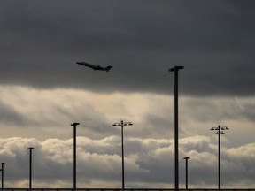 An aircraft takes off from Vancouver International Airport in Richmond, B.C., on Monday, December 26, 2022. The union representing food service workers at Vancouver International Airport says more than 200 have walked off the job to push for higher wages.