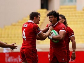 Canada captain Phil Berna, left, and teammate Noah Flesch celebrate Flesch's winning try in a 24-19 victory in extra time over Chile in quarterfinal play on Day 3 of the World Rugby Sevens Repechage in Monaco in a Sunday, June 23, 2024, handout photo.