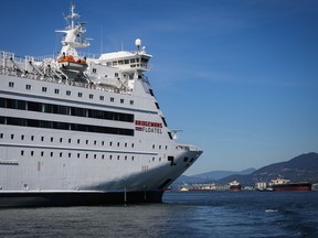 A renovated cruise ship known as a "floatel" is seen at anchor in the harbour in Vancouver, on Thursday, May 9, 2024.