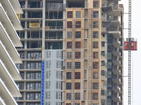 Overcrowding, which is calculated on the number of people living together per square foot inside a dwelling, is at its worst in almost a century in English-speaking countries. (Photo: New apartments under construction in Burnaby, 2023.)