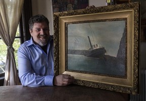Mark Garner with a painting of the S.S. Beaver he bought in Burnaby Thursday. Garner operates an S.S. Beaver museum in Hamilton, Ont.