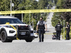 Police investigate a shooting that occurred outside a home on 164th Street and 10th Avenue in Surrey, BC Friday morning June 7, 2024.