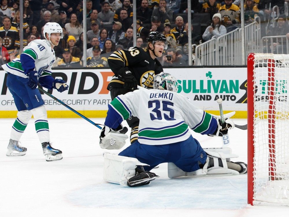 Danton Heinen scores against new teammate Thatcher Demko in February.