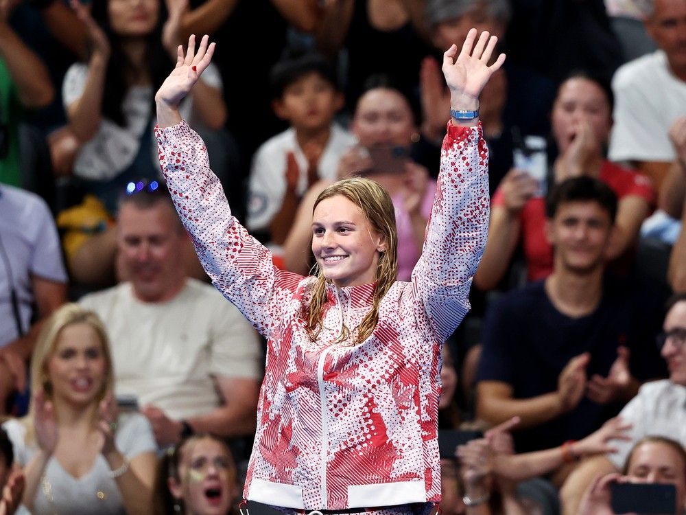Gold Medalist Summer McIntosh of Team Canada celebrates during the Swimming medal ceremony after the Women's 400m Individual Medley Final on day three of the Olympic Games Paris 2024 at Paris La Defense Arena on July 29, 2024 in Nanterre, France.