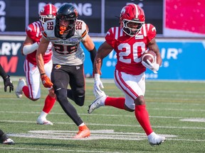Calgary Stampeders running back Peyton Logan carries the ball during CFL action against the B.C. Lions at McMahon Stadium on Sunday July 21, 2024.