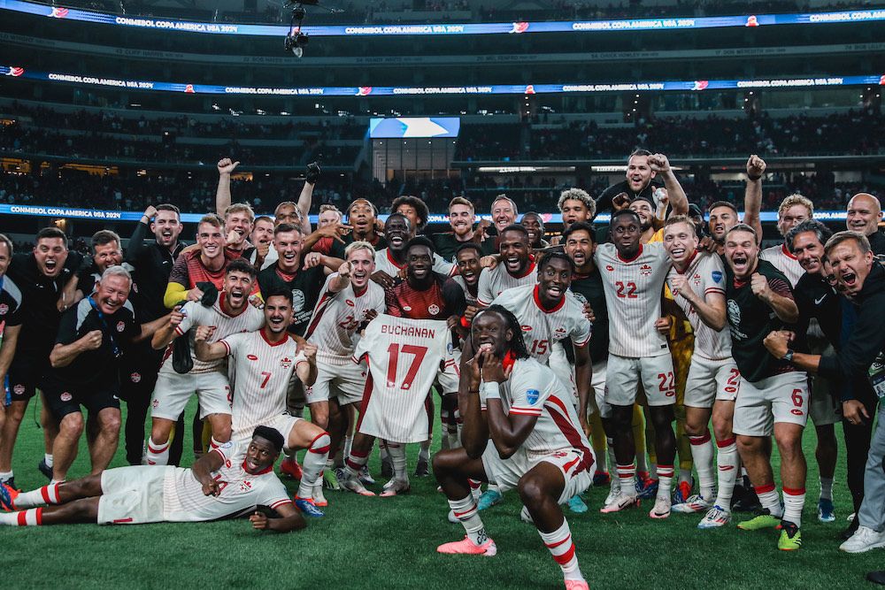 A group celebration photo of Team Canada