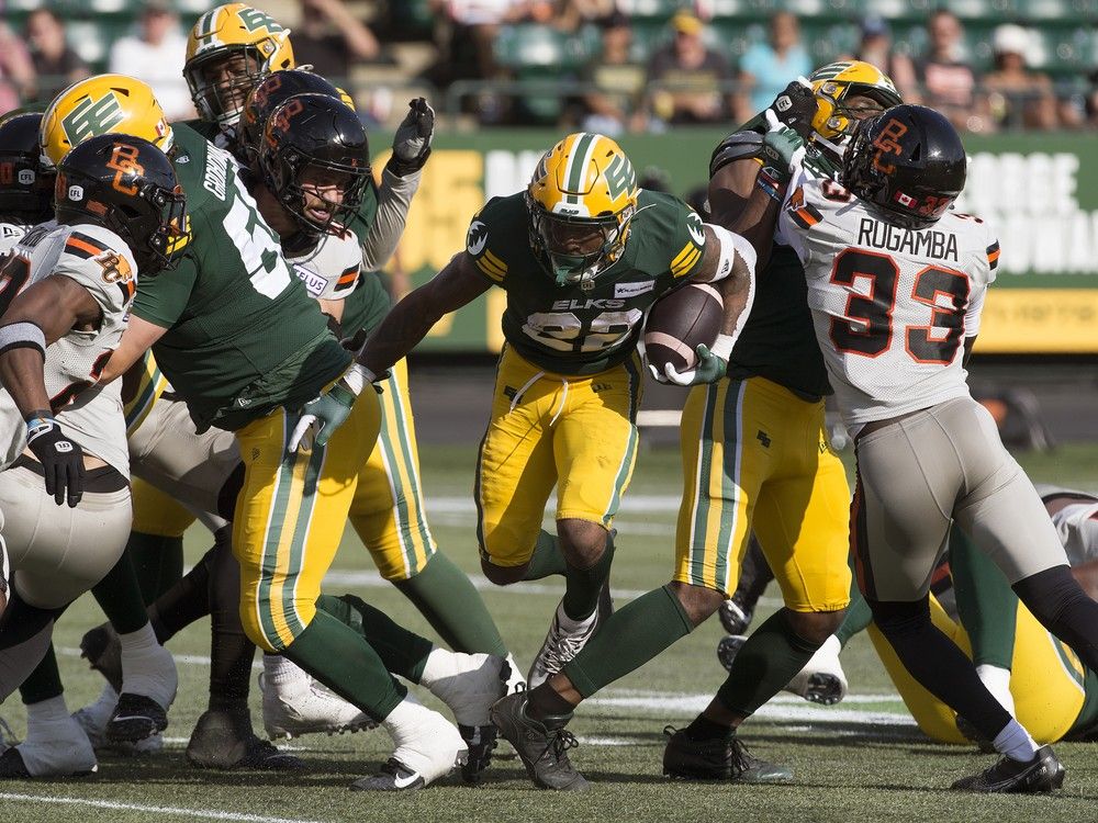 The Edmonton Elks' Javon Leake (22) runs the ball against the B.C. Lions during CFL action at Commonwealth Stadium, in Edmonton Sunday Aug. 11, 2024. Photo by David Bloom