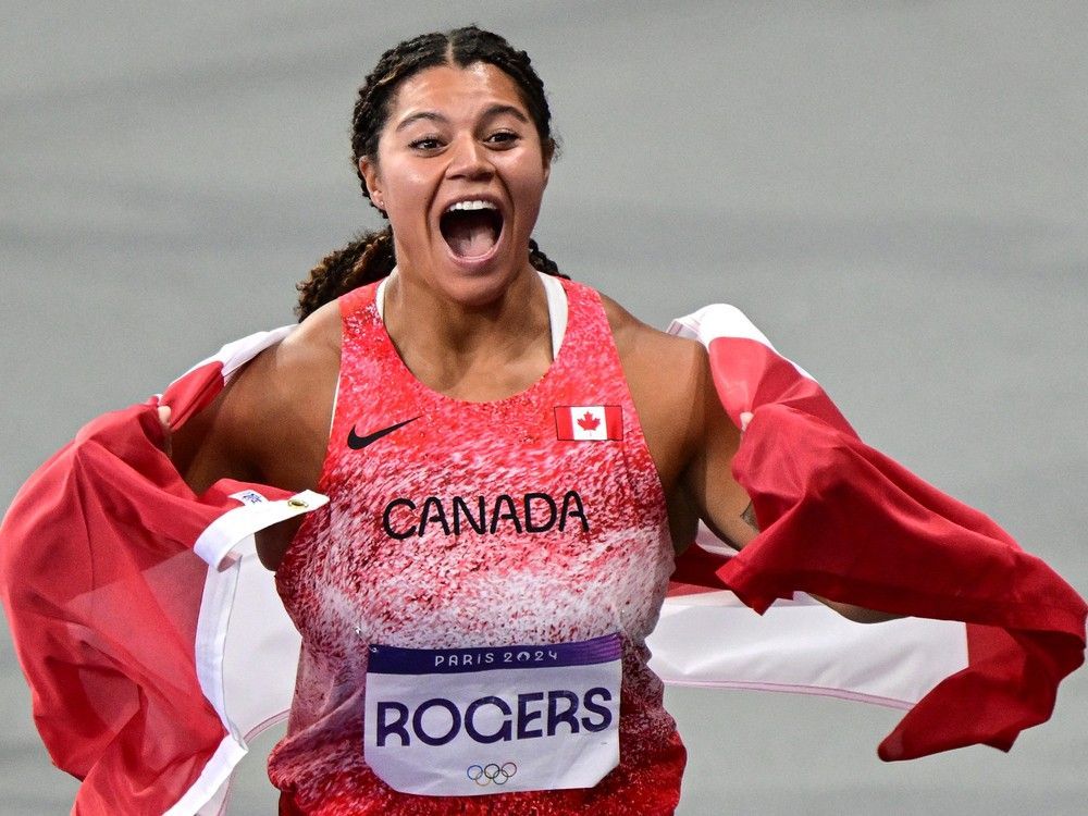Canada's Camryn Rogers celebrates winning the women's hammer throw final of the athletics event at the Paris 2024 Olympic Games.