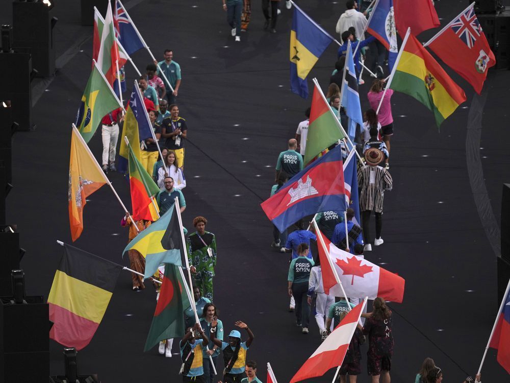Flagbearers parade during the 2024 Summer Olympics closing ceremony at the Stade de France, Sunday, Aug. 11, 2024, in Saint-Denis, France.