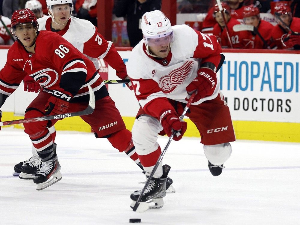 Detroit Red Wings' Daniel Sprong  moves the puck away from Carolina Hurricanes' Teuvo Teravainen March 28, 2024. Vancouver is Sprong’s sixth team, and the knock on him is that he’s had issues defensively.