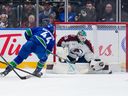 Canucks winger Kiefer Sherwood finishes off a shorthanded breakaway for one of his three goals Saturday in a 3-1 win over the Avalanche at Rogers Arena.