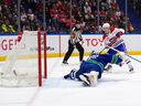 Cole Caufield scores on Kevin Lankinen during the second period at Rogers Arena.