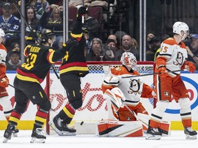Vancouver Canucks' Teddy Blueger and Kiefer Sherwood