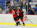 Mazden Leslie (No. 47) and Colton Roberts congratulate one another during the Vancouver Giants' 6-2 win over the Everett Silvertips on Feb. 8 at the Langley Events Centre. Photo: Rob Wilton