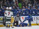 Vancouver Canucks' Conor Garland checked out teammate Derek after fighting Yakov Trenin of Minnesota Wild in Phase 3.