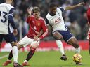 Manchester United's Alejandro Garnacho, left, challenges Tottenham's Kevin Danso during an English Premier League match earlier this year.