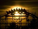 PNE photographer Craig Hodge's photo of riders on the Roller Coaster at sunset, 2006.