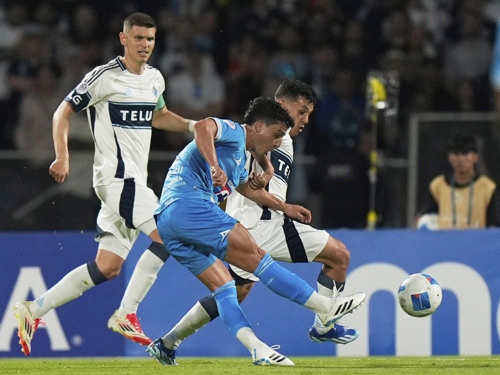 Lorenzo Faravelli of Mexico's Cruz Azul, front, scores his side's 2nd goal against Canada's Vancouver Whitecaps during the CONCACAF Champions Cup final soccer match in Mexico City, Sunday, June 1, 2025.