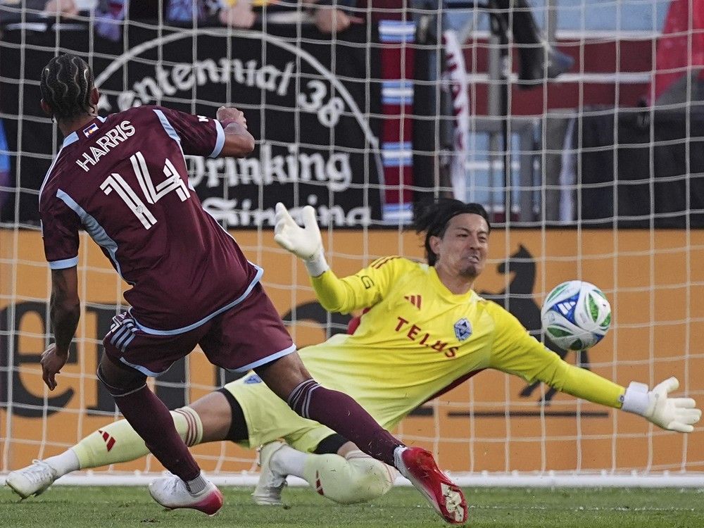 Colorado Rapids forward Calvin Harris scores past Vancouver Whitecaps goalkeeper Yohei Takaoka in MLS match Saturday, July 12, 2025, in Commerce City, Colo.