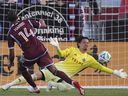 Colorado Rapids forward Calvin Harris scores past Vancouver Whitecaps goalkeeper Yohei Takaoka in MLS match Saturday, July 12, 2025, in Commerce City, Colo.