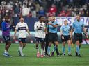 Referee Tim Ford (centre right) is followed by Vancouver Whitecaps players as he left the field after Los Angeles FC defeated the Caps during a game in November, 2023.