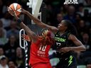 Ezi Magbegor of the Seattle Storm blocks a shot by Rhyne Howard of the Atlanta Dream at Climate Pledge Arena on Aug. 13 in Seattle.