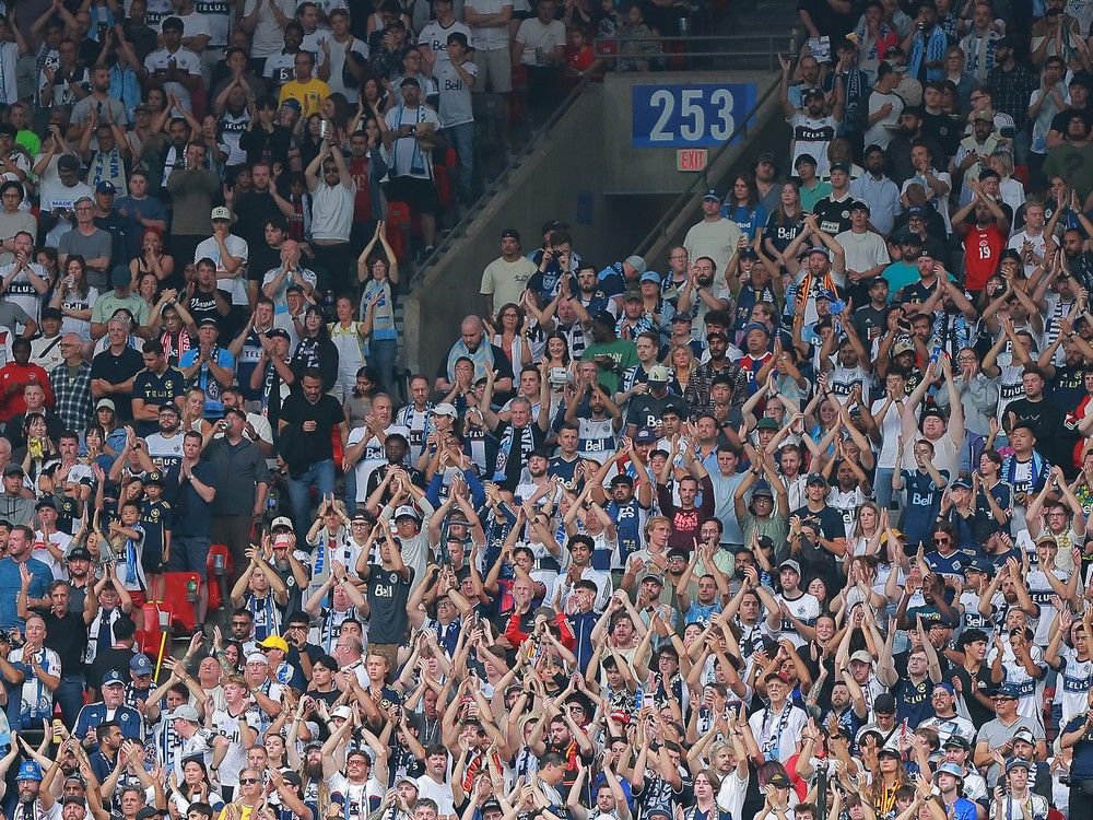 Whitecaps fans cheer on their team during a match against Houston Dynamo at B.C. Place on Aug. 17.