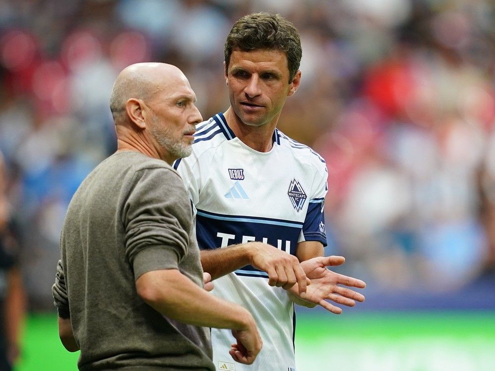 Jesper Sørensen, Head Coach of the Vancouver Whitecaps FC gives instructions to Thomas Müller #13 of the Vancouver Whitecaps FC during the MLS match between Vancouver Whitecaps FC and Houston Dynamo FC at BC Place on August 17, 2025 in Vancouver, British Columbia.