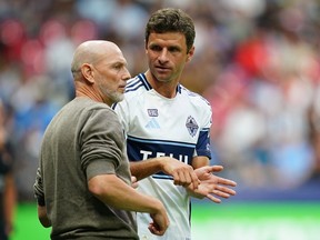 Jesper Sørensen, Head Coach of the Vancouver Whitecaps FC gives instructions to Thomas Müller #13 of the Vancouver Whitecaps FC during the MLS match between Vancouver Whitecaps FC and Houston Dynamo FC at BC Place on August 17, 2025 in Vancouver, British Columbia.