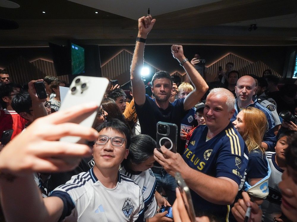 New Vancouver Whitecaps player Thomas Muller smiles after arriving from Germany at Vancouver International Airport in Richmond, B.C., on Wednesday, August 13, 2025.