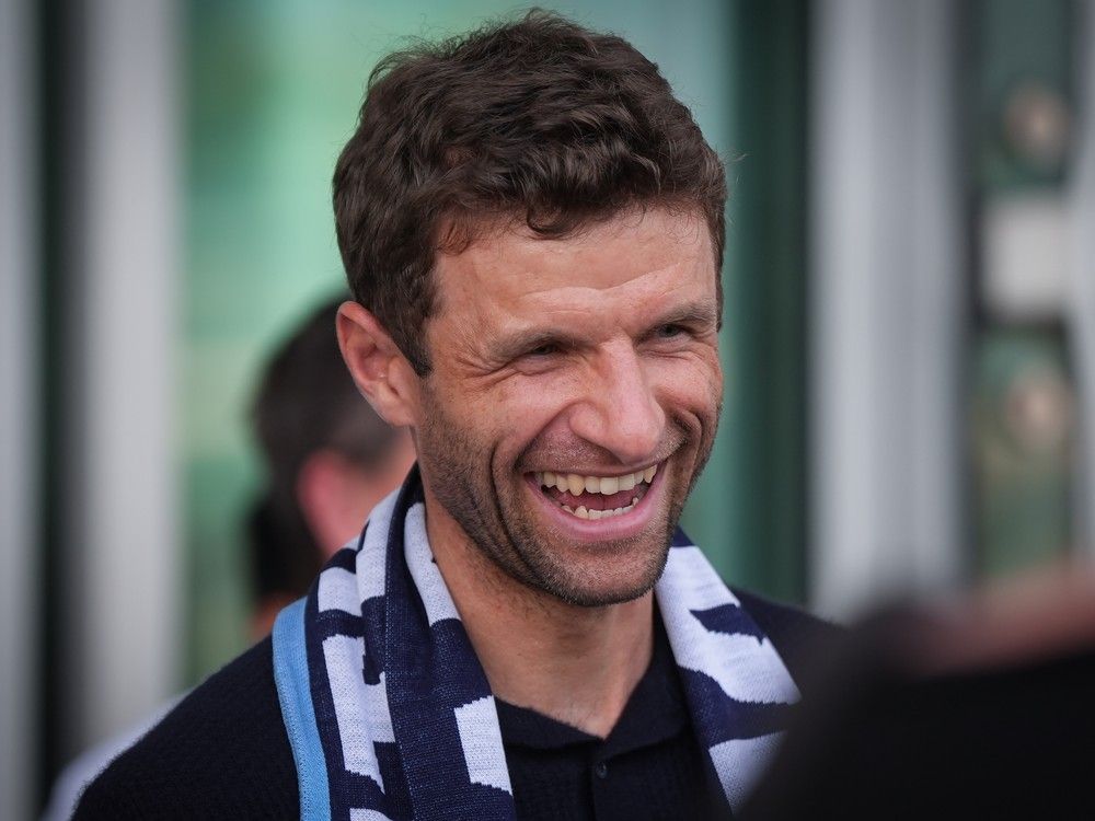 New Vancouver Whitecaps player Thomas Muller smiles after arriving from Germany at Vancouver International Airport in Richmond, B.C., on Wednesday, August 13, 2025.