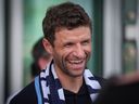 New Vancouver Whitecaps player Thomas Muller smiles after arriving from Germany at Vancouver International Airport in Richmond, B.C., on Wednesday, August 13, 2025.